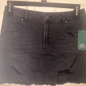 Distressed mini denim skirt